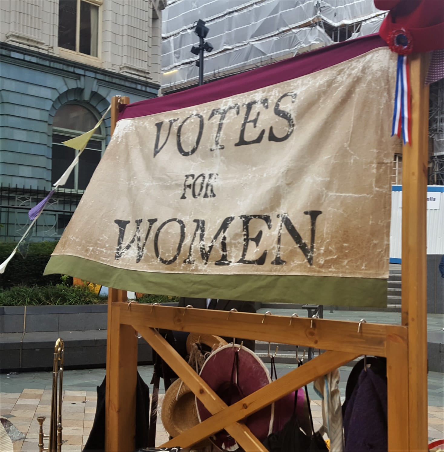 Banner behind the stage at Suffrage in the City